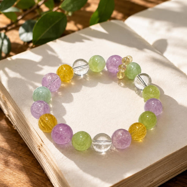Crystal beaded bracelet with lavender, green, and yellow stones and clear spacer beads