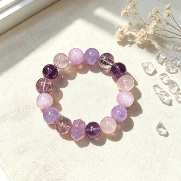 Amethyst and rose quartz beaded bracelet with round purple and pink beads and clasp