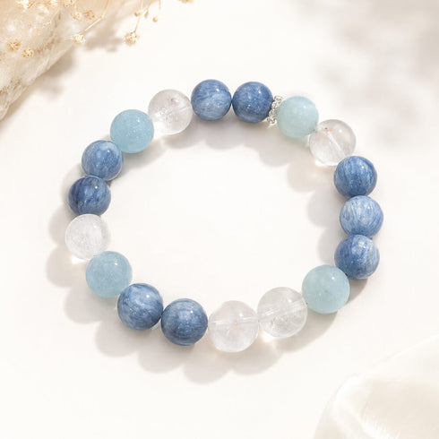 Beaded blue and aqua crystal bracelet with clear round beads and silver-tone spacers