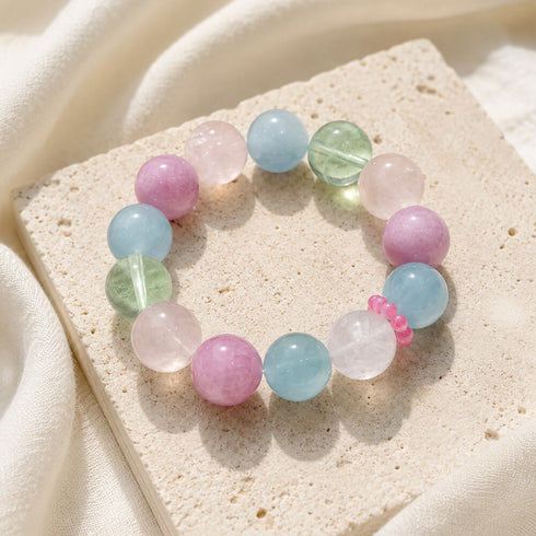 Gemstone bead bracelet with pastel round stones in pink, blue, green, and clear