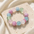 Gemstone bead bracelet with pastel round stones in pink, blue, green, and clear