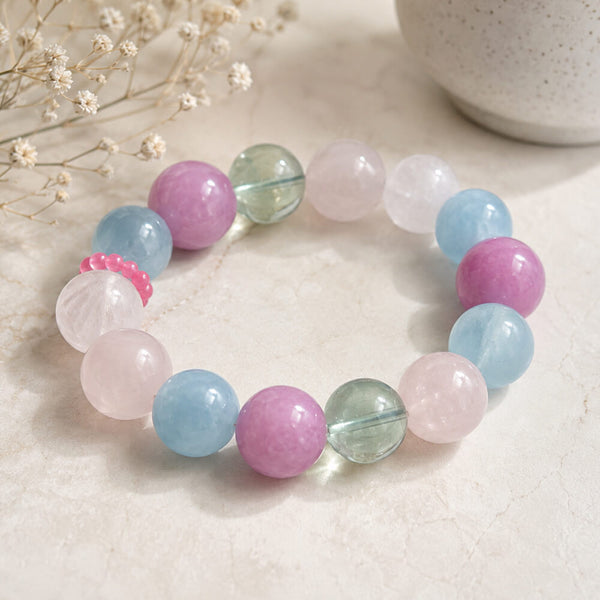 Gemstone bead bracelet with pastel round beads in lilac, aqua, and pale green tones