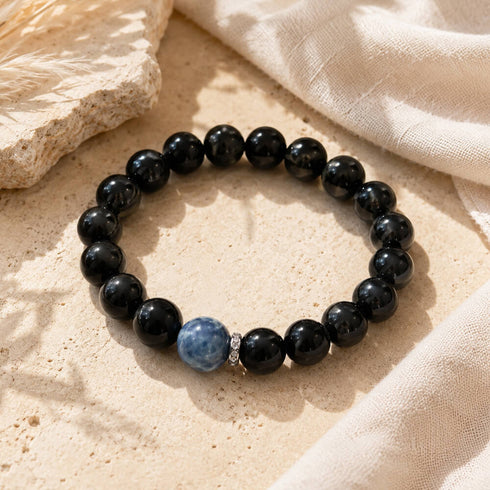 Black round bead bracelet with blue round crystal accent stone