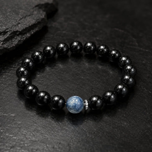 Black bead bracelet with blue round center crystal stone, close-up