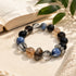 Black beaded crystal bracelet with blue stones and brown sparkly bead accents