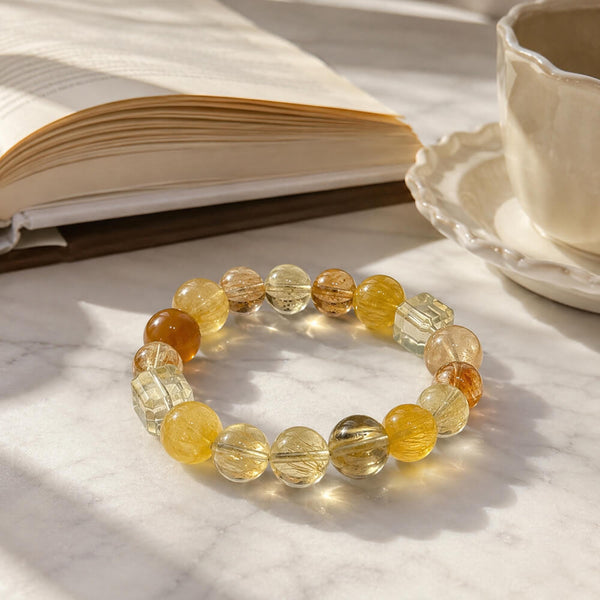 Yellow and clear crystal bead bracelet with round beads and faceted spacers