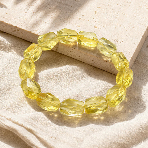 Citrine crystal bracelet with oval faceted yellow stones in a round elastic fit