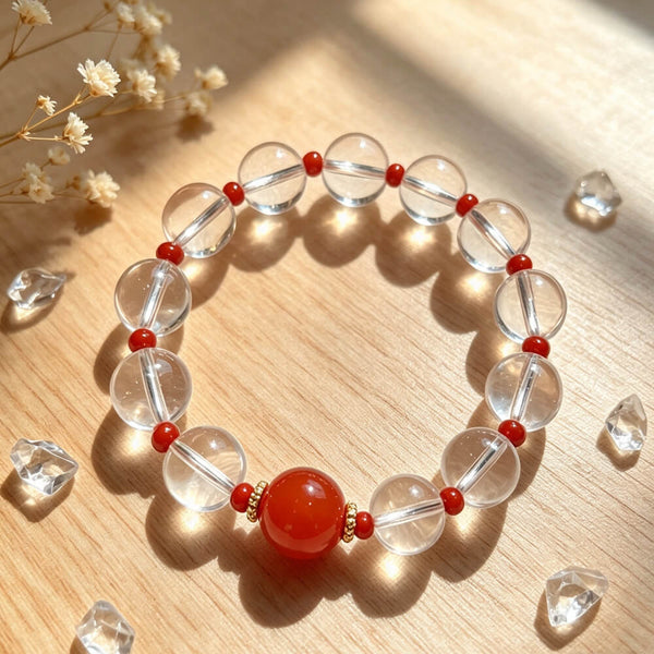 Clear quartz crystal bead bracelet with red round center stone and red accents