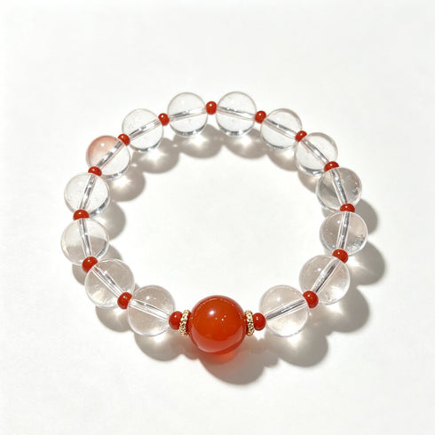 Clear quartz crystal bead bracelet with glossy red center stone and red accent beads