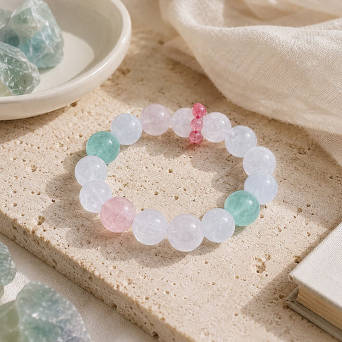 Crystal beaded bracelet with clear beads, pink accents, and mint green beads