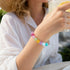 Colorful crystal bead bracelet with multi-color round beads, worn on wrist
