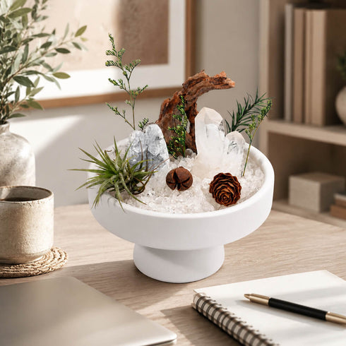 White bowl crystal garden centerpiece with clear quartz, greenery sprigs, brown rose ornaments