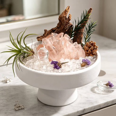 White bowl crystal garden centerpiece with pink rose quartz cluster, clear crystals, purple accents