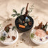 Set of three mini crystal garden bowls on a table with assorted crystals and greenery