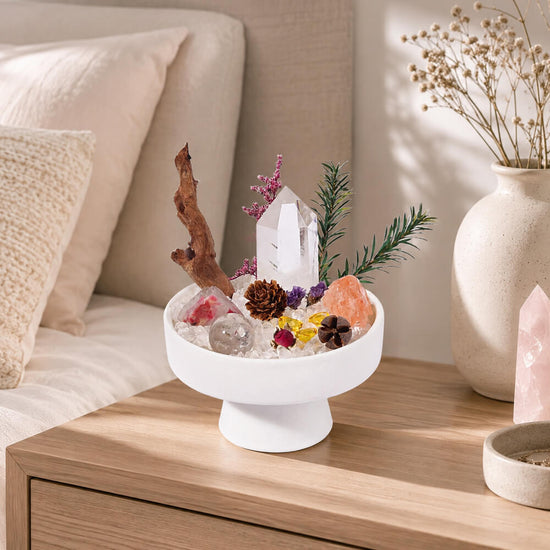 Crystal centerpiece bowl on wooden surface with clear quartz and citrine stones