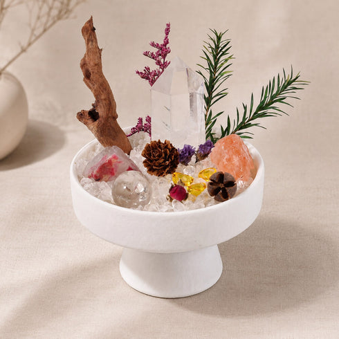 Clear quartz and citrine crystal decor in a white round pedestal bowl