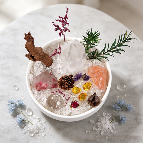 Top view of white crystal bowl with clear quartz shards and citrine beads