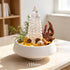Crystal garden decor kit with clear pagoda tower, stones, and crystal pieces on white bowl