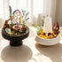 Two crystal garden decor kits with crystal trees and pagoda towers on black and white stands