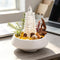 Crystal garden decor kit with clear pagoda tower, orange beads, and crystals on white bowl
