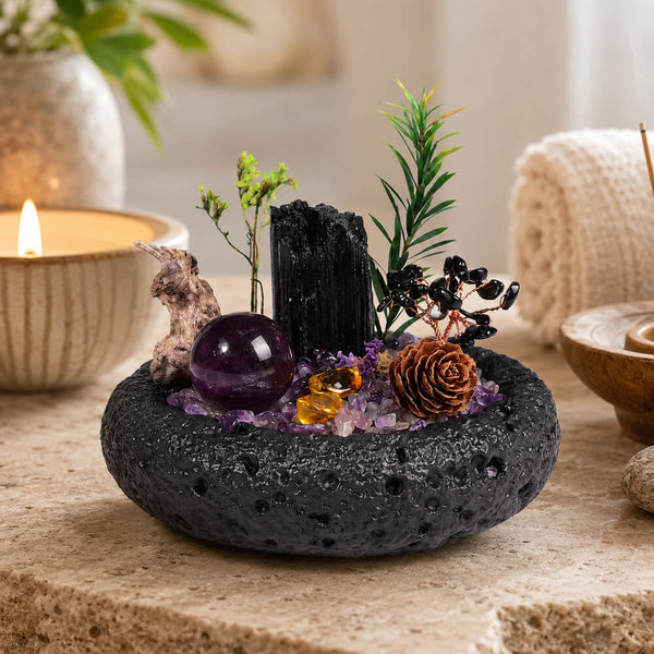 Black lava-stone crystal money tree centerpiece with amethyst orb, citrine crystals, greenery