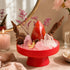 Red crystal garden centerpiece with rose quartz clusters, red agate crystal, and stems