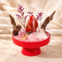 Red crystal garden kit centerpiece with brown wood stems, pink quartz stones, and red agate