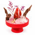 Red decorative crystal garden kit on stand with red agate and rose quartz pieces