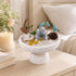 White pedestal bowl crystal tree decor with turquoise branches, gray rock, pine greenery, and pinecone