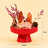 Red crystal garden centerpiece on a pedestal base with pink branches and orange crystal towers