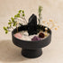 Tabletop crystal garden kit: round black bowl filled with crystals, blooms, and greenery
