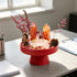 Red pedestal crystal garden kit centerpiece with orange crystal towers and pink sprig stems
