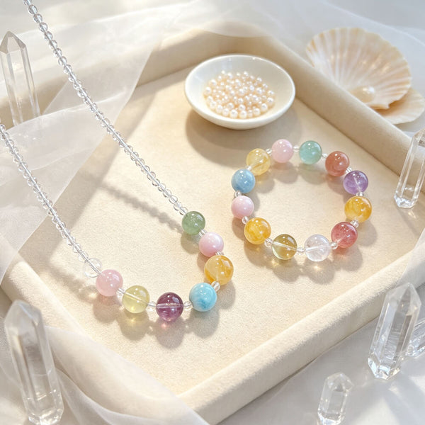 Pastel crystal bead bracelet with round aqua, pink, yellow, purple, and clear beads.