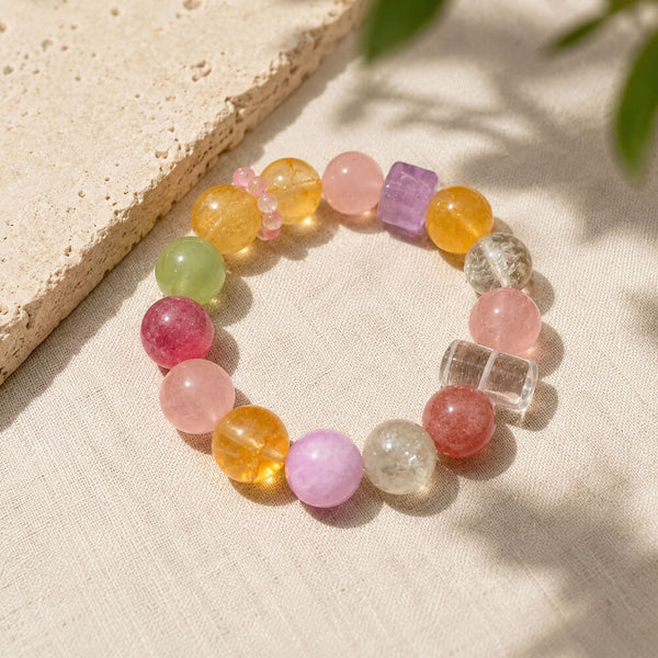 Multi-color crystal beaded bracelet with pink, purple, orange, and clear round stones
