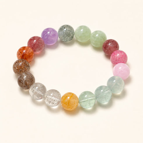 Flat-lay multicolor crystal bracelet with round beads in purple, green, orange, and pink