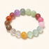 Flat-lay multicolor crystal bracelet with round beads in purple, green, orange, and pink
