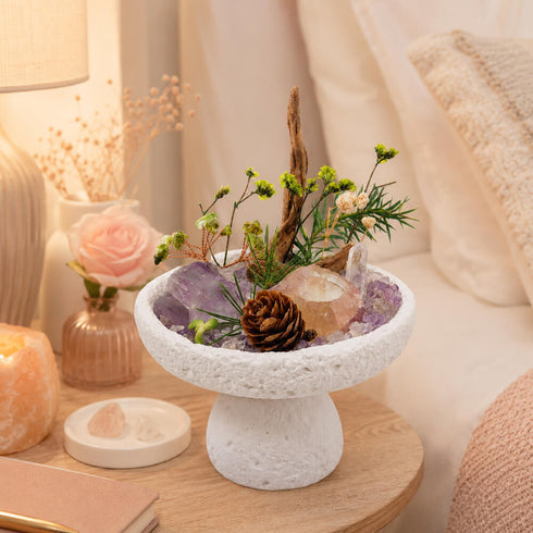 Natural crystal bonsai centerpiece with amethyst-like crystal, pinecone, and green stems