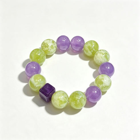 Purple and green gemstone bead bracelet with faceted cube accent