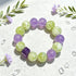 Round purple and green crystal bead bracelet with purple cube detail