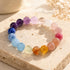 Rainbow beaded crystal bracelet with purple, pink, and blue round stones