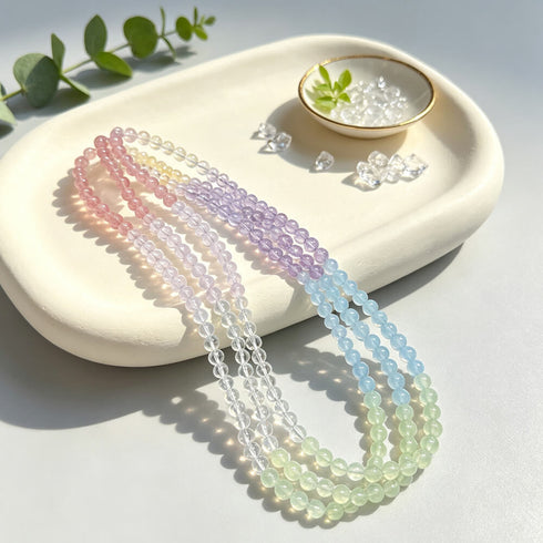 Pastel rainbow gemstone bead bracelet with pink, lavender, blue, and mint strands