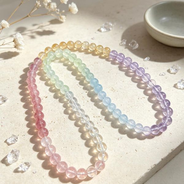 Rainbow beaded bracelet with pink, mint, blue, and purple round gemstone beads