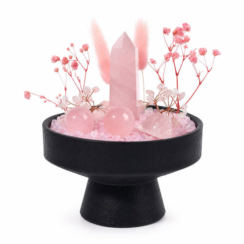 Studio view crystal kit centerpiece with black pedestal stand and pink rose quartz crystals