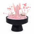 Studio view crystal kit centerpiece with black pedestal stand and pink rose quartz crystals