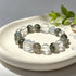 Crystal bead bracelet with green phantom quartz, light blue beads, and clear faceted cube