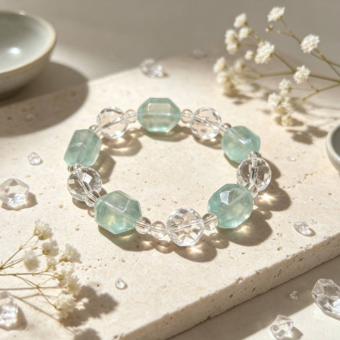 Crystal beaded bracelet with clear and light aqua faceted beads, centered view