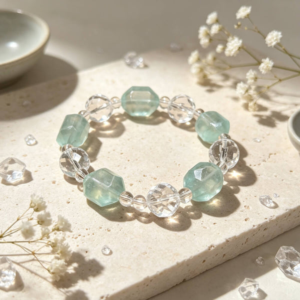 Crystal beaded bracelet with clear and light aqua faceted beads, centered view