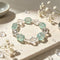 Crystal beaded bracelet with clear and light aqua faceted beads, centered view