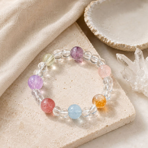 Beaded crystal bracelet with clear spacer beads and multicolor round stone charms