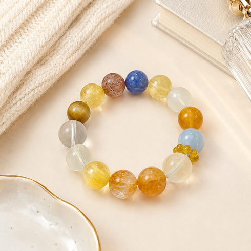 Multicolor beaded crystal bracelet with round yellow, blue, and clear gemstone beads